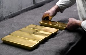 Gold edges lower after US inflation data; near record highs